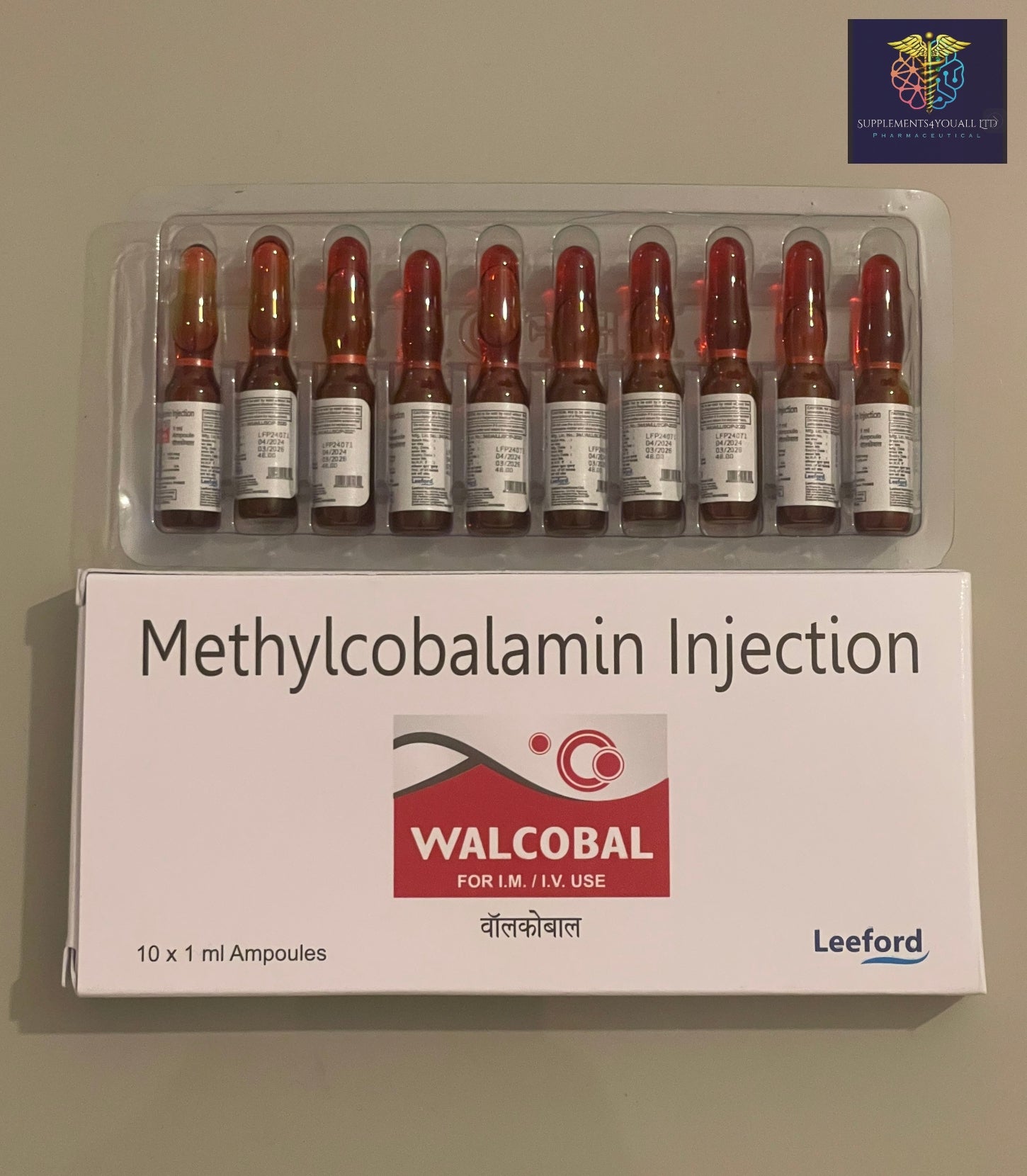 A box of 10 red ampoules containing B12 from WALCOBAL against a grey background.